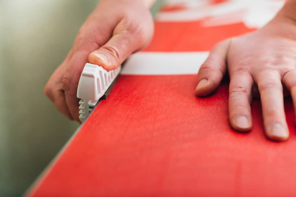 Demonstrating how to sharpen snowboard edges